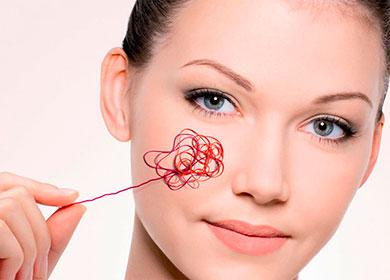 Fil rouge sur le visage