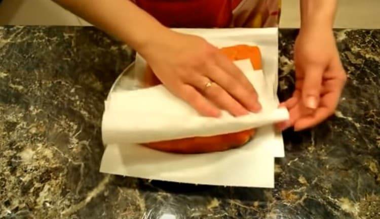 We wash salted fish from salt and get wet with napkins.