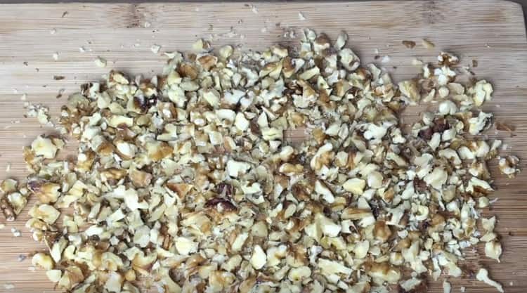 Grind walnuts in any convenient way.