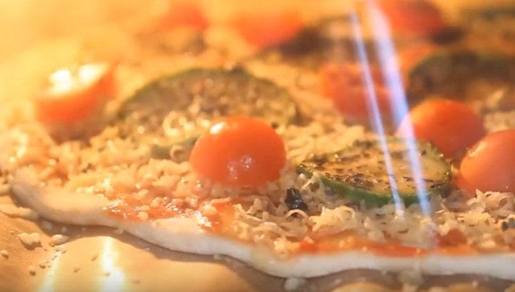 We send pizza to the oven.