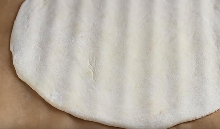 We shift the workpiece onto a parchment-covered grate.