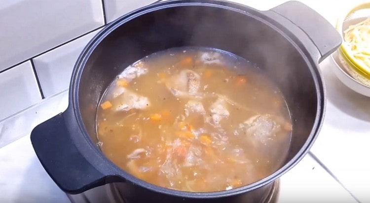 Cook the soup over low heat.