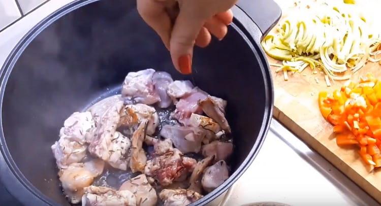 Add rosemary to the meat.