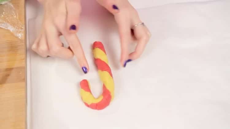 To make Christmas cookies, preheat the oven