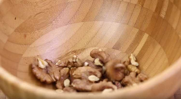 We shift the hot nuts into the bowl.