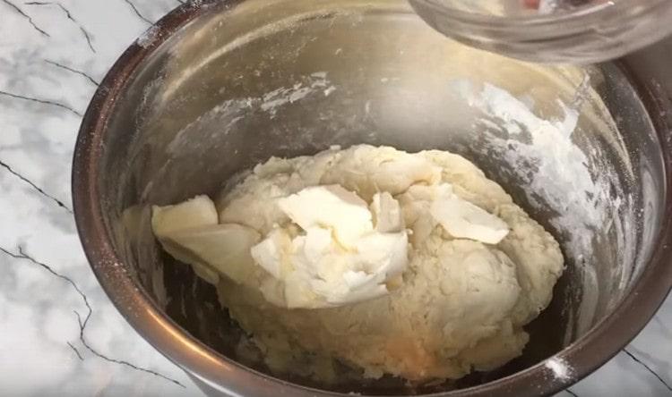 Add soft butter to the dough.