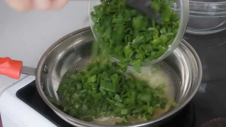 Fry the onions to make the tortillas.