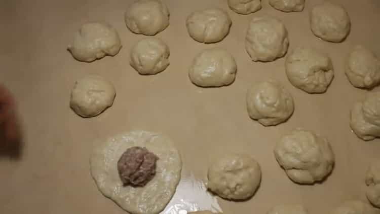 To prepare meat pies, put the filling on the dough