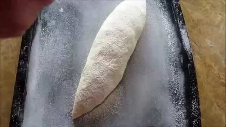 De acordo com a receita, para cozinhar pão branco no forno, pré-aqueça o forno