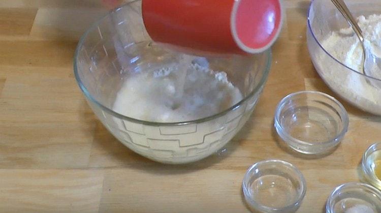 Add water and mix the mass.