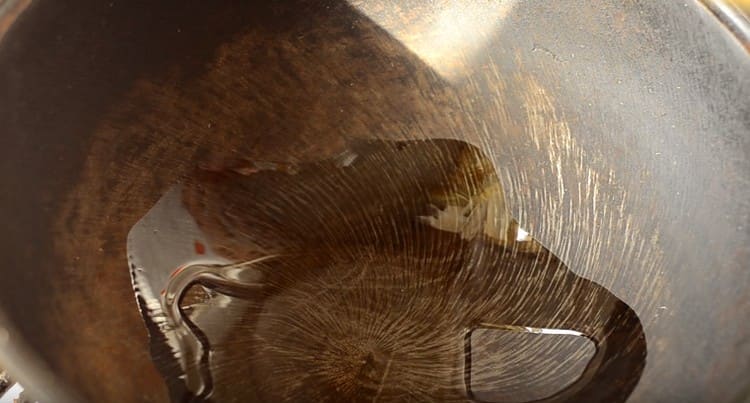 We heat the wok pan.