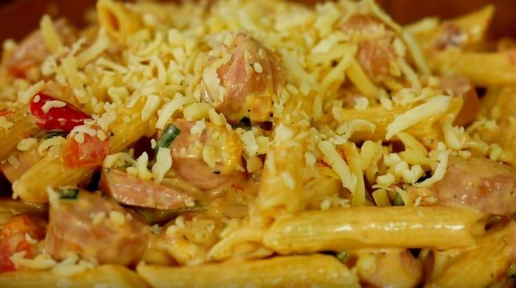 When serving pasta with sausages, you can sprinkle with grated cheese.