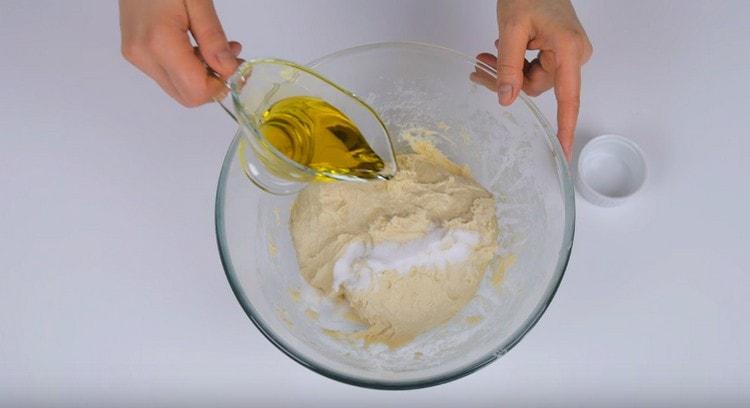 Add salt and olive oil to the dough.