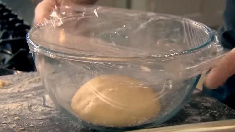 Cover the dough in a bowl with cling film and leave it to rise.