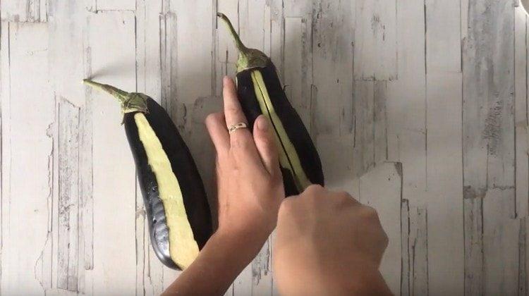 We make fairly deep cuts in each eggplant.