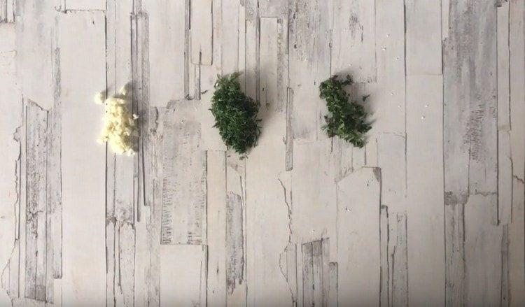 Grind garlic, mint, herbs.