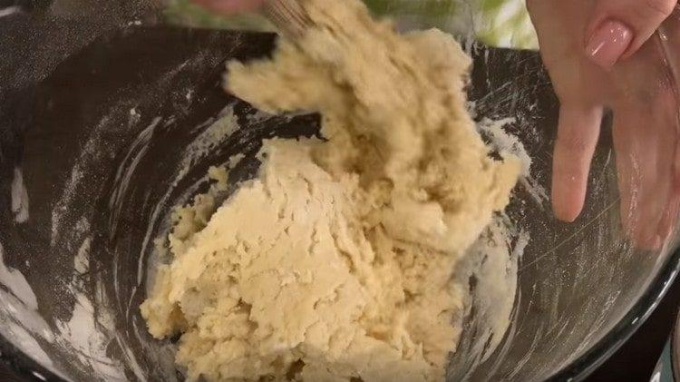 mix the dough, then knead it with your hands.